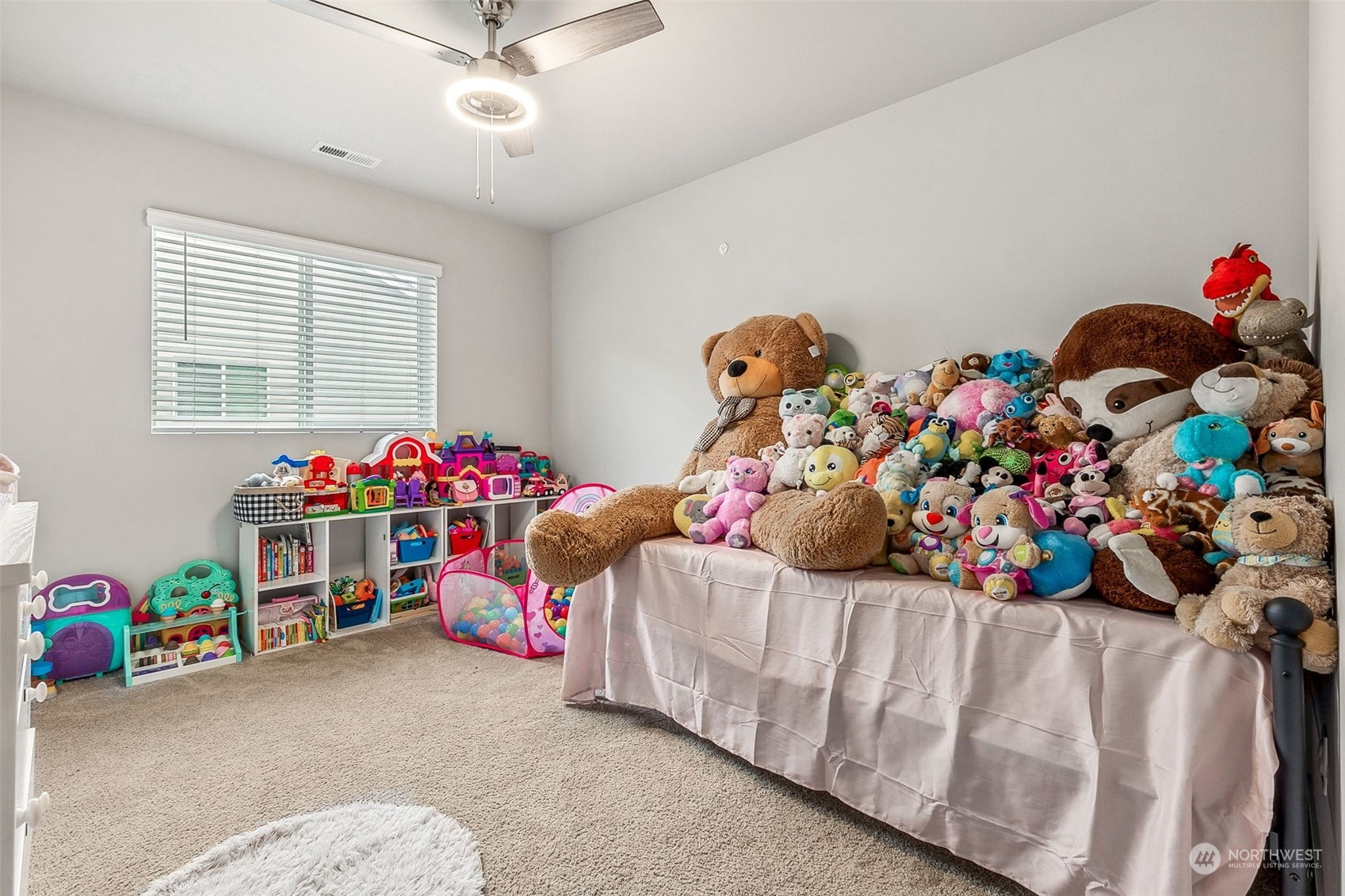 2926 Fiddleback Street Northeast Lacey, WA 98516 - Photo 17 of 29 a bedroom with furniture and a fan