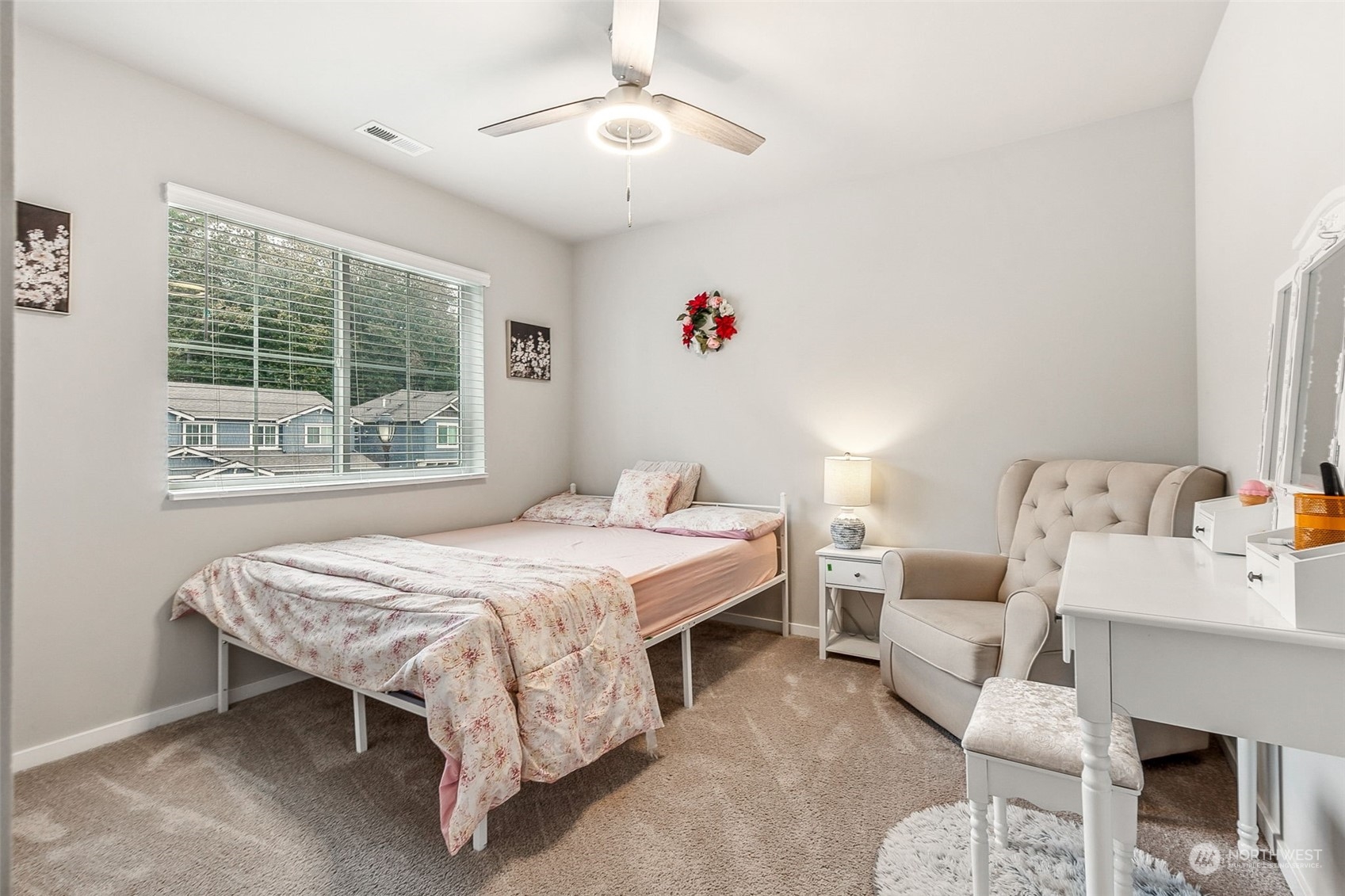 2926 Fiddleback Street Northeast Lacey, WA 98516 - Photo 18 of 29 a bed room with a bed and a chair