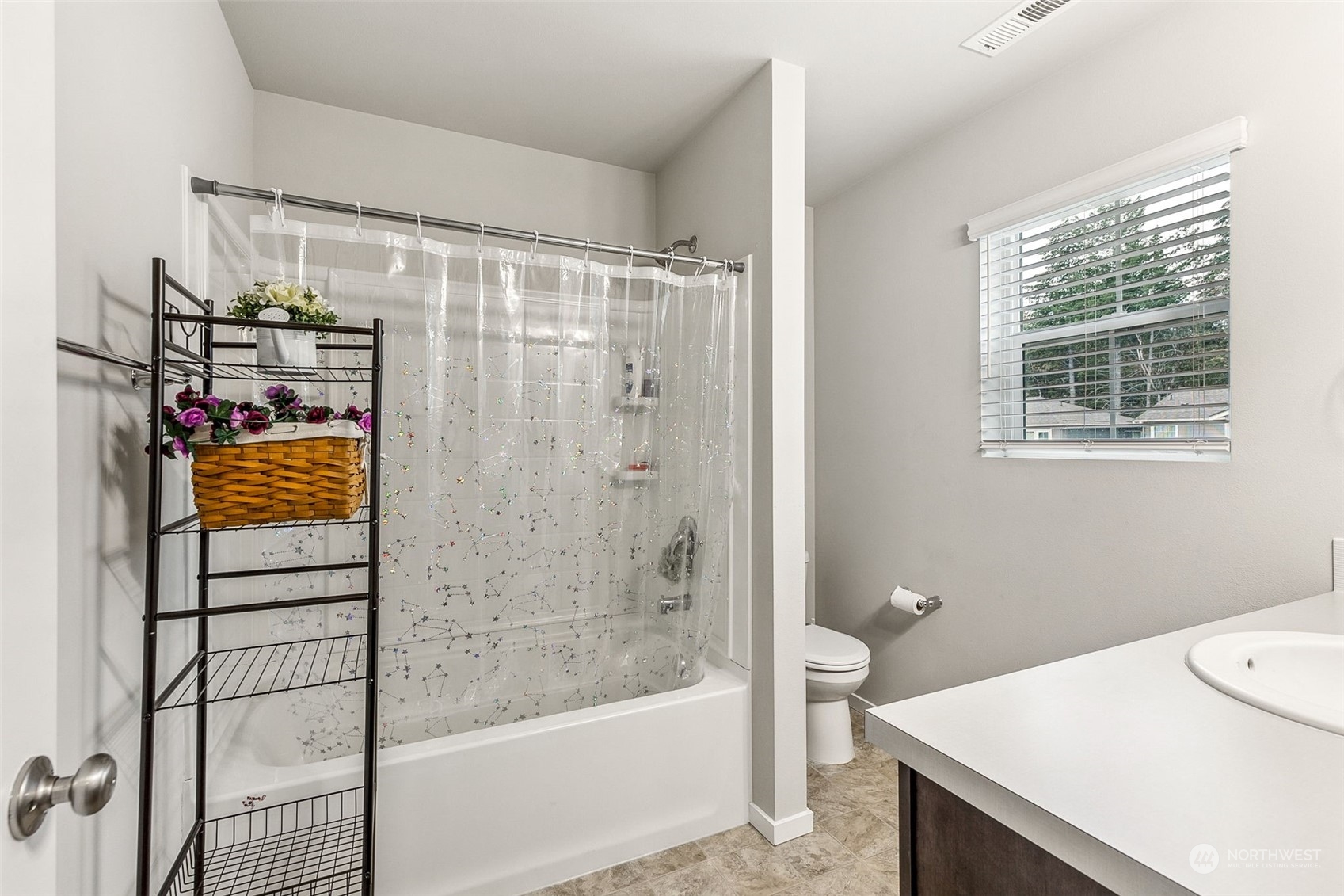 2926 Fiddleback Street Northeast Lacey, WA 98516 - Photo 20 of 29 a bathroom with a bathtub shower sink vanity and toilet