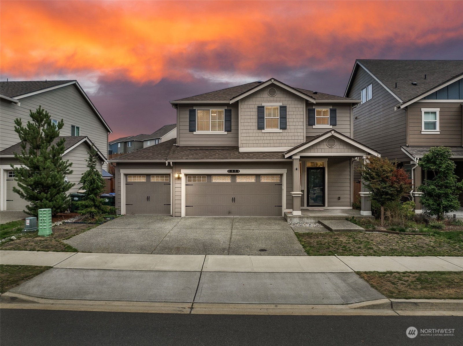 2926 Fiddleback Street Northeast Lacey, WA 98516 - Photo 2 of 29 a front view of a house with a yard and garage