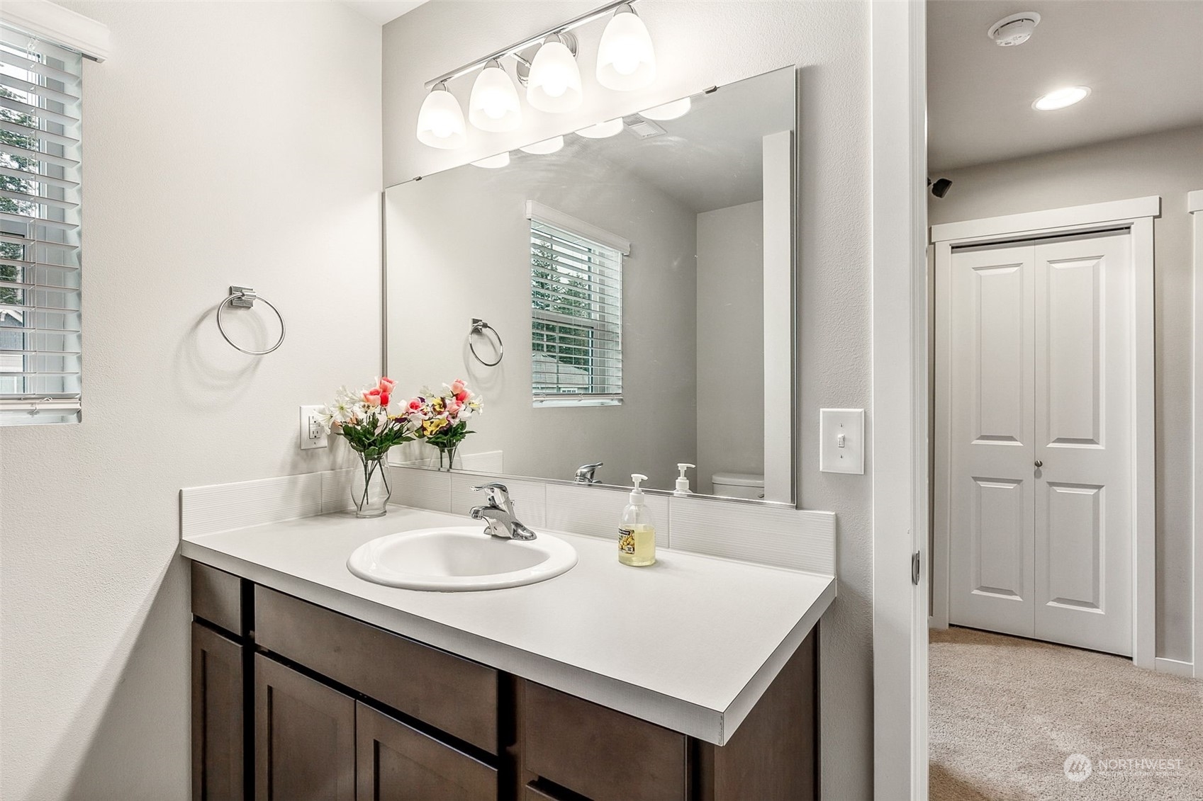 2926 Fiddleback Street Northeast Lacey, WA 98516 - Photo 21 of 29 a bathroom with a sink and a mirror