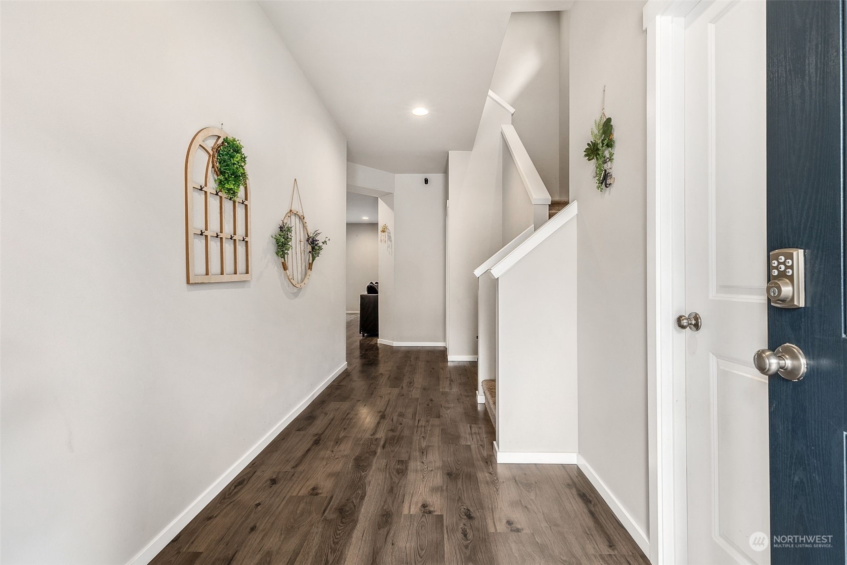 2926 Fiddleback Street Northeast Lacey, WA 98516 - Photo 4 of 29 a view of a hallway with wooden floor and entryway