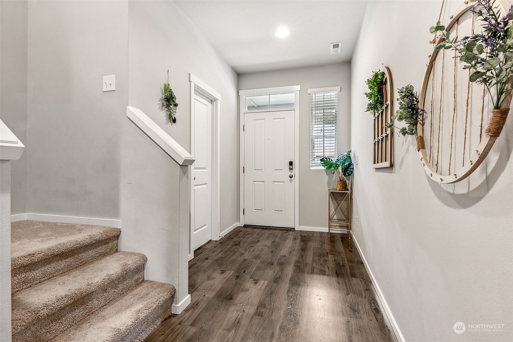 2926 Fiddleback Street Northeast Lacey, WA 98516 - Photo 5 of 29 a view of a hallway with wooden floor and entryway