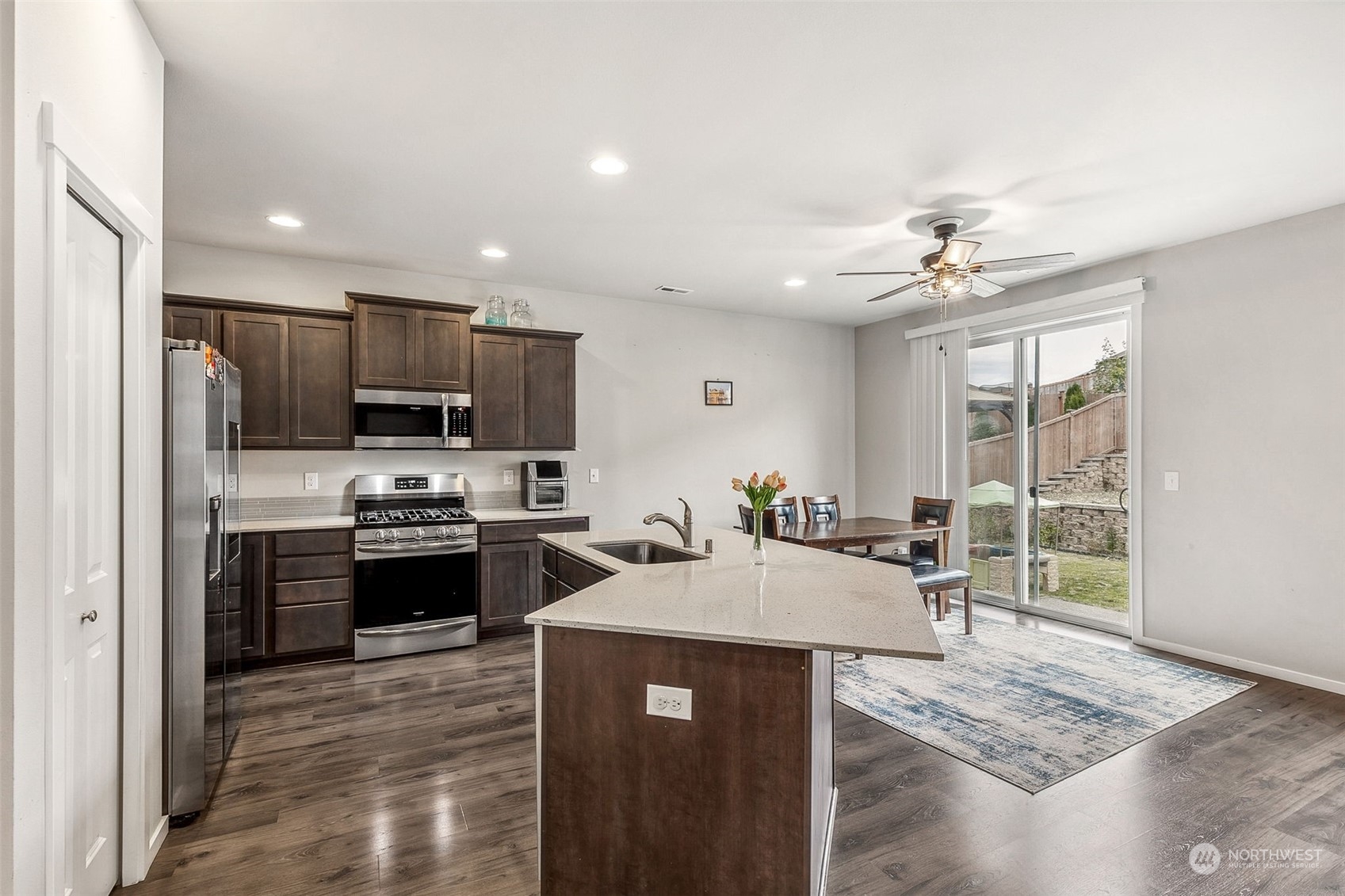 2926 Fiddleback Street Northeast Lacey, WA 98516 - Photo 9 of 29 a kitchen with stainless steel appliances granite countertop a sink stove and refrigerator