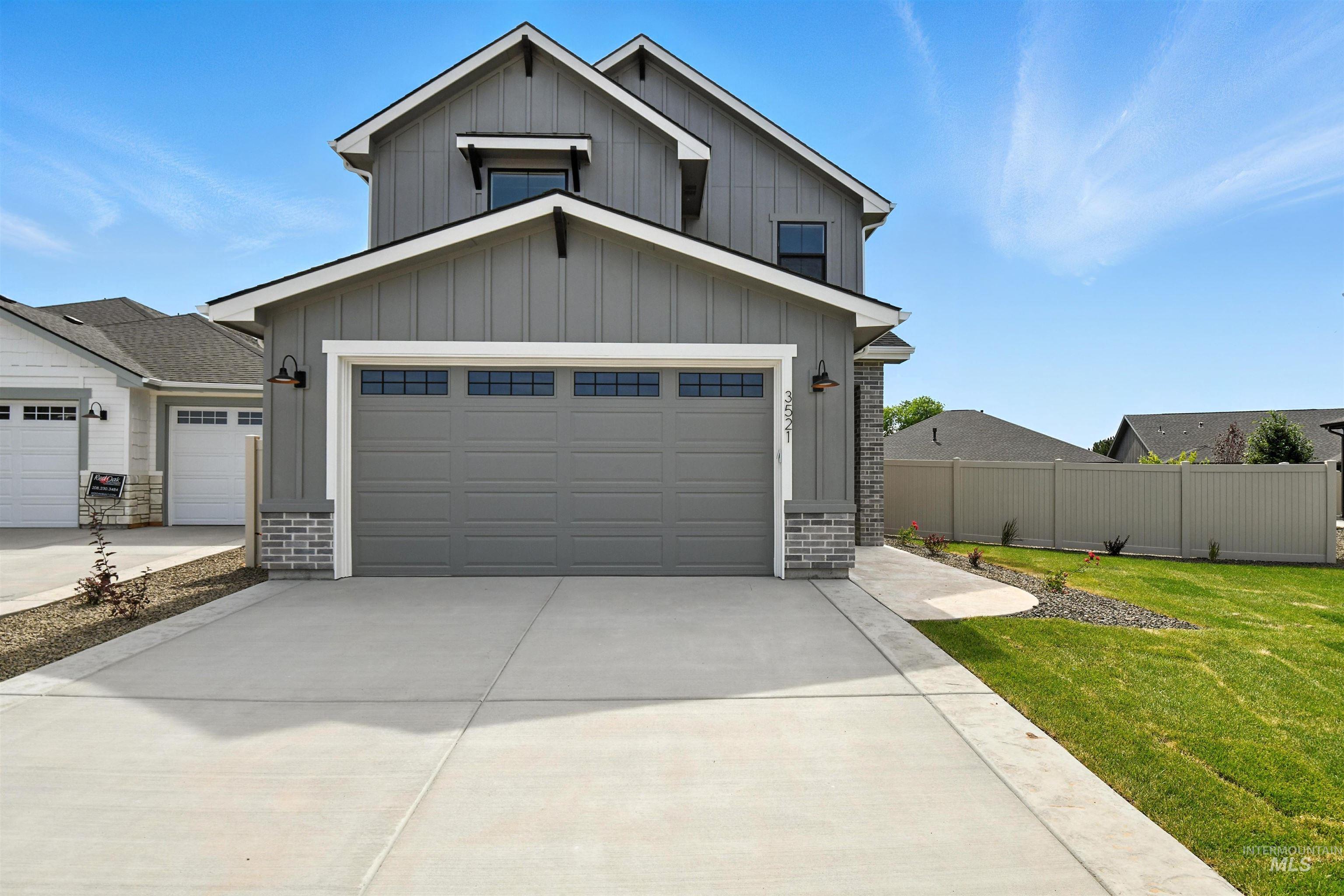 3521 South El Rio Avenue Boise, ID 83709 - Photo 2 of 38 View of front of property with board and batten siding and concrete driveway