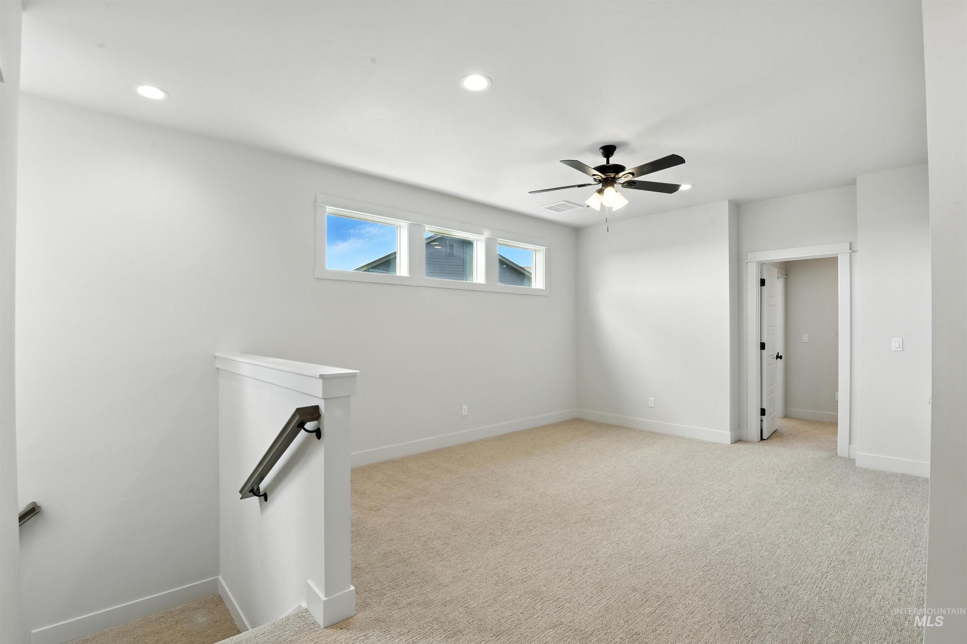 3521 South El Rio Avenue Boise, ID 83709 - Photo 27 of 38 Unfurnished room with light colored carpet, recessed lighting, and a ceiling fan