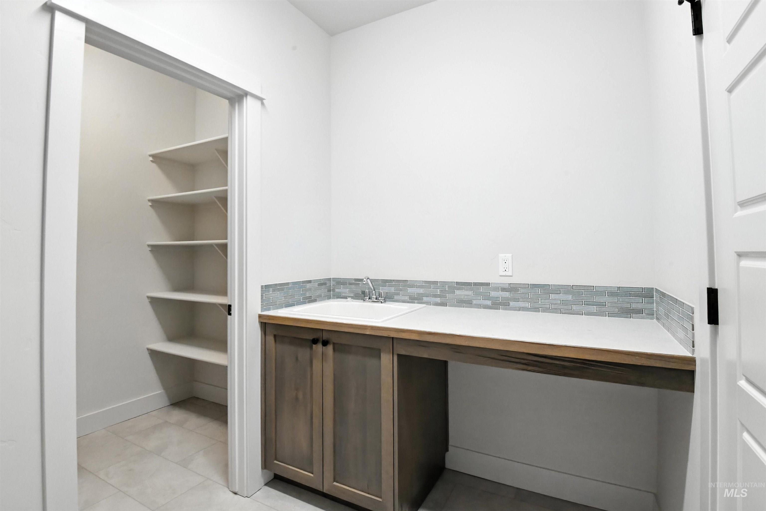 3521 South El Rio Avenue Boise, ID 83709 - Photo 32 of 38 Bathroom with tile patterned floors and vanity