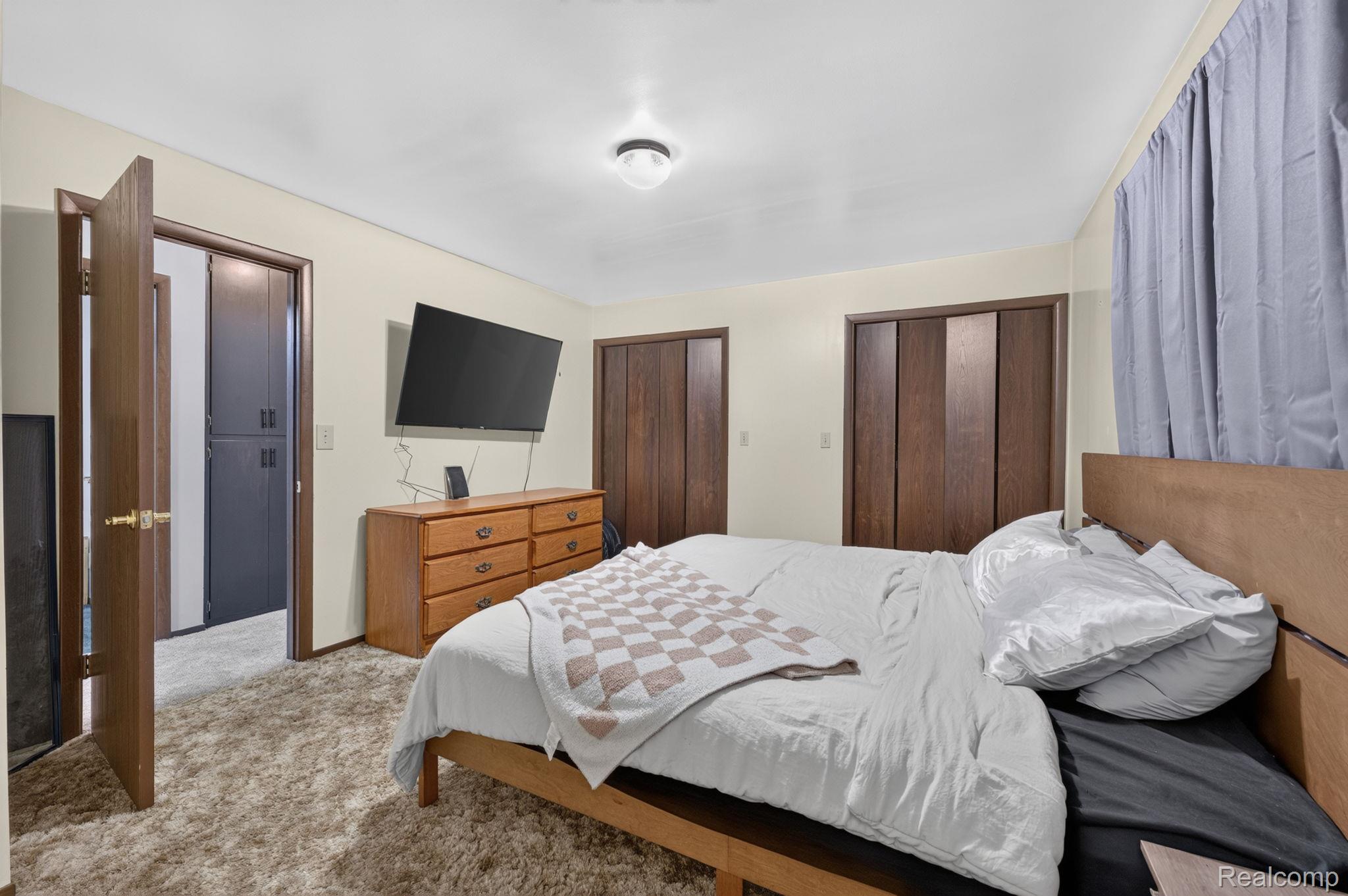 5330 Sheridan Road Saginaw, MI 48601 - Photo 35 of 50 Carpeted room featuring light beige walls and a flush-mount ceiling light