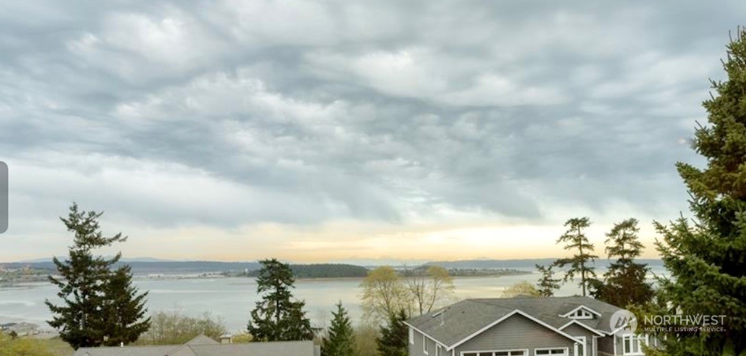 2331 Freund Street Oak Harbor, WA 98277 - Photo 3 of 10 a view of a lake with a city in the background