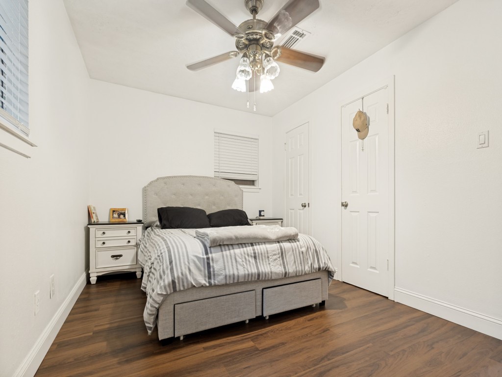 124 Bluebird Lane Pasadena, TX 77502 - Photo 6 of 25 a bedroom with a bed and a chandelier