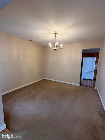 a view of a room with a hanging light
