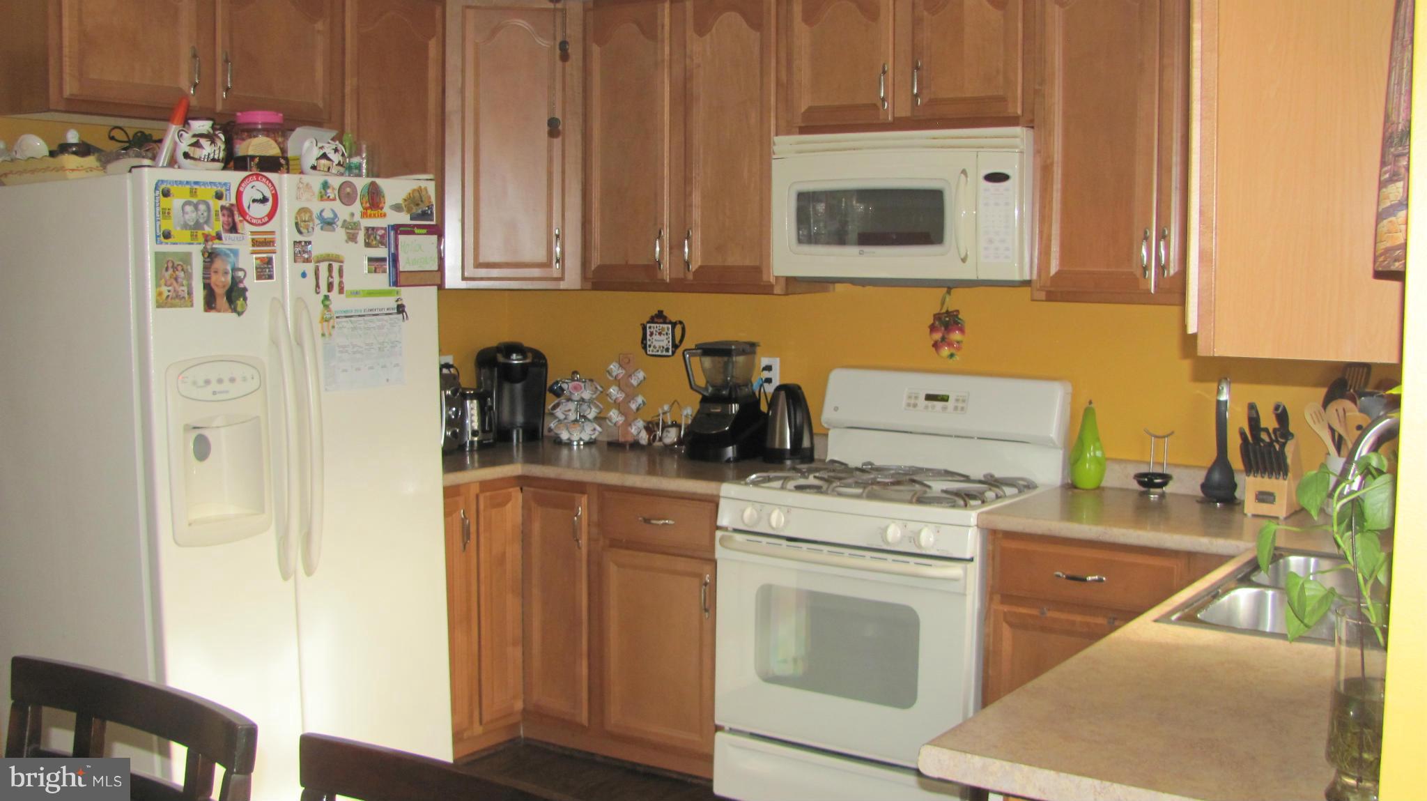 2929 Gracefield Road Silver Spring, MD 20904 - Photo 5 of 25 a kitchen with a refrigerator stove and sink