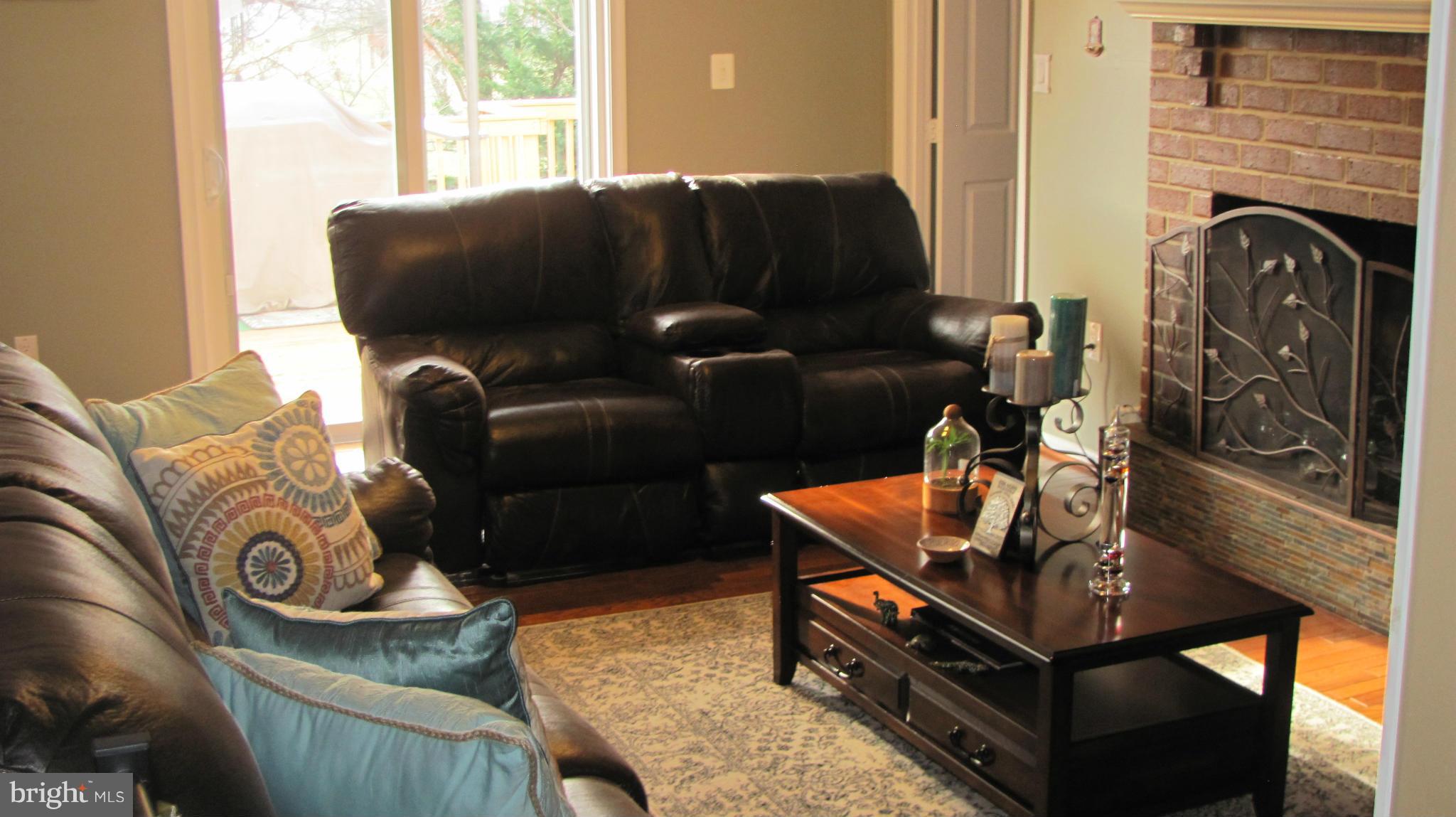 2929 Gracefield Road Silver Spring, MD 20904 - Photo 6 of 25 a living room with furniture and a fireplace
