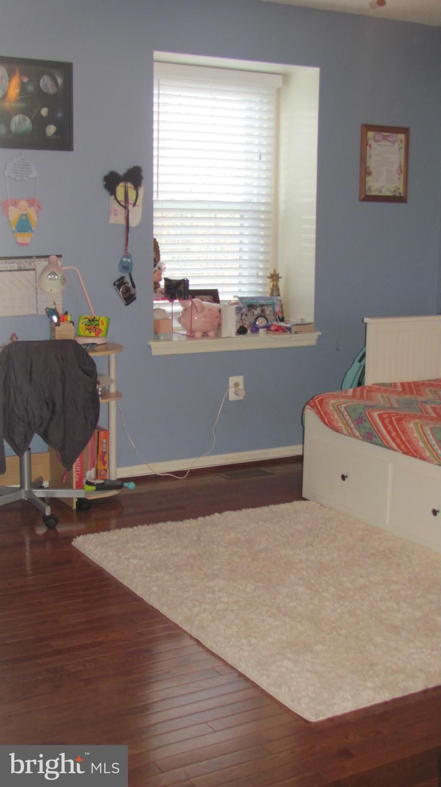 2929 Gracefield Road Silver Spring, MD 20904 - Photo 8 of 25 a bedroom with a bed and a window
