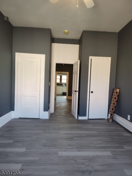 304 Front Street, Unit 4B Belvidere, NJ 07823 - Photo 3 of 8 a view of an empty room with wooden floor and a window