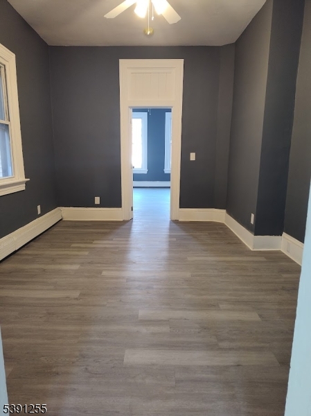 304 Front Street, Unit 4B Belvidere, NJ 07823 - Photo 5 of 8 a view of an empty room with wooden floor and a window