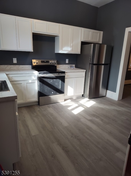 304 Front Street, Unit 4B Belvidere, NJ 07823 - Photo 7 of 8 a kitchen with a refrigerator and a sink