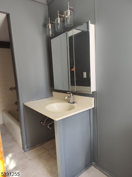 304 Front Street, Unit 4B Belvidere, NJ 07823 - Photo 8 of 8 a bathroom with a sink and a mirror