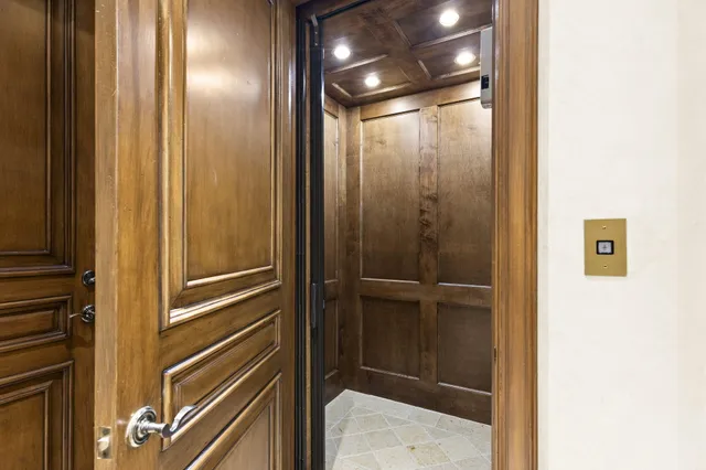 a bathroom with a glass shower door