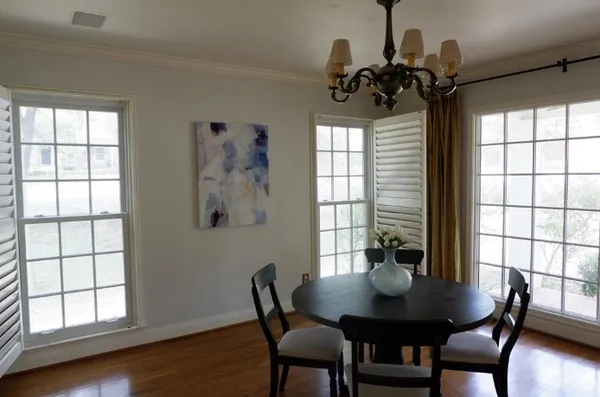 a view of a dining room with furniture and window