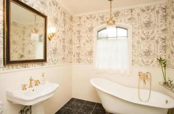 a bathroom with a sink a bathtub and a sink