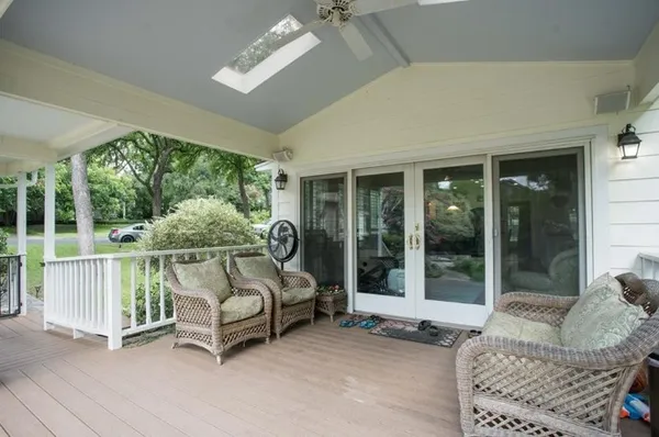 a balcony with furniture and a window