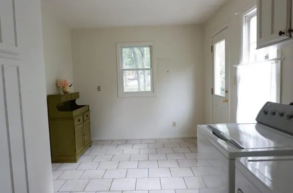a room with window and a table