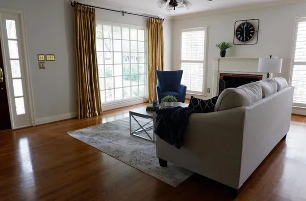 a living room with furniture and a fireplace