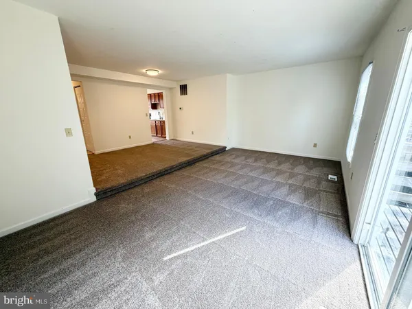 a view of a big room with closet and wooden floor