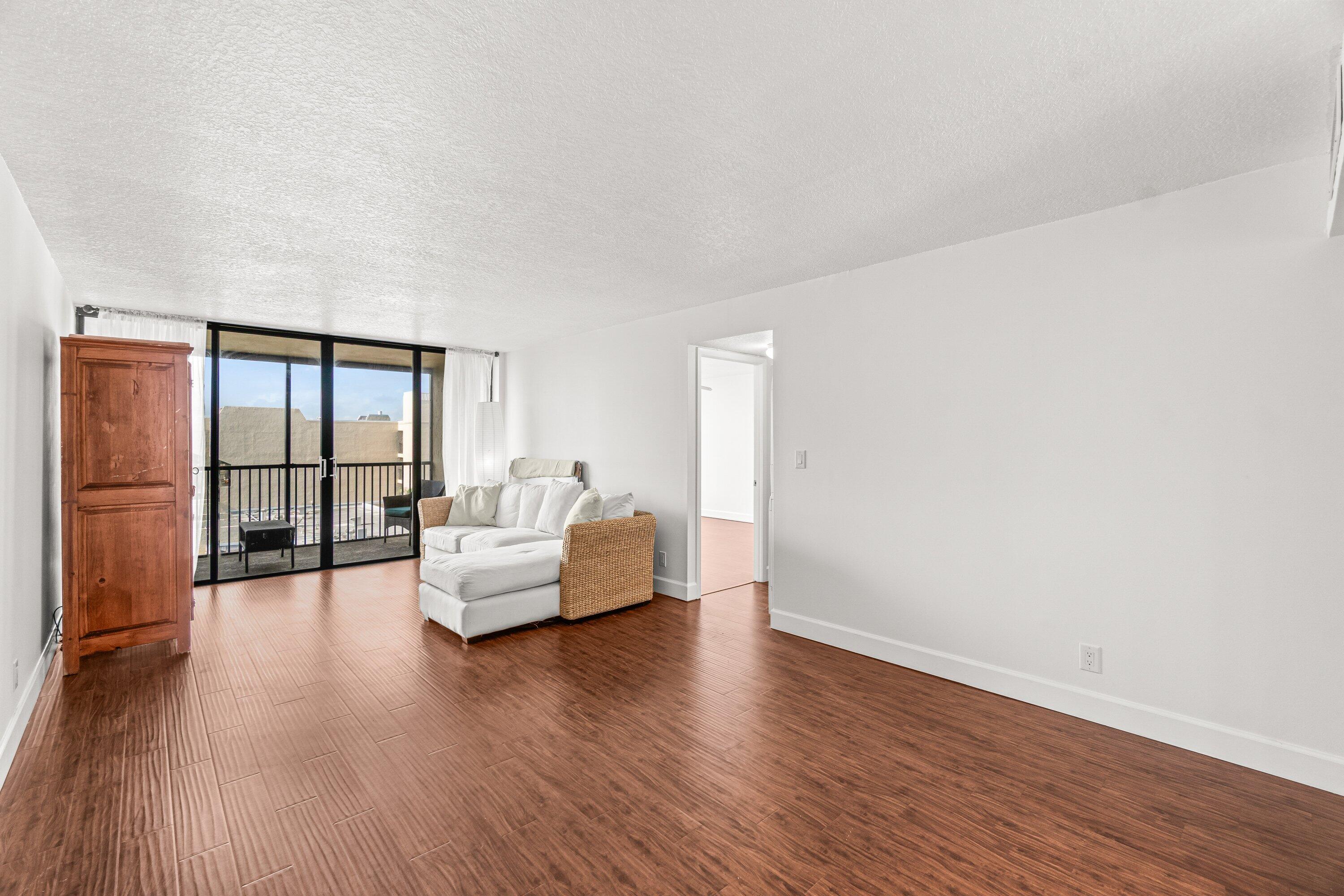 15 Royal Palm Way, Unit 604 Boca Raton, FL 33432 - Photo 11 of 41 a living room with furniture and a large window