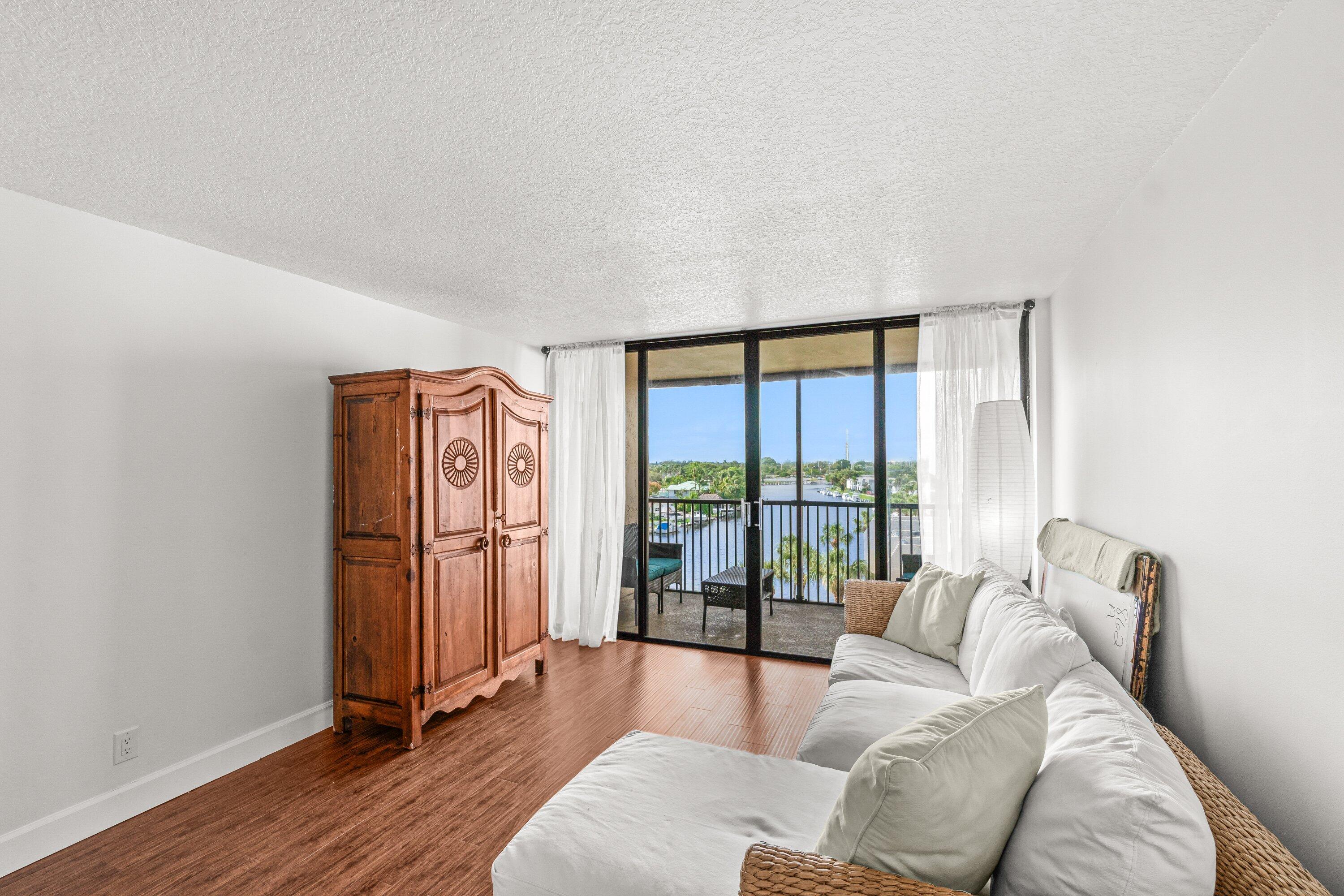 15 Royal Palm Way, Unit 604 Boca Raton, FL 33432 - Photo 12 of 41 a living room with furniture and a large window