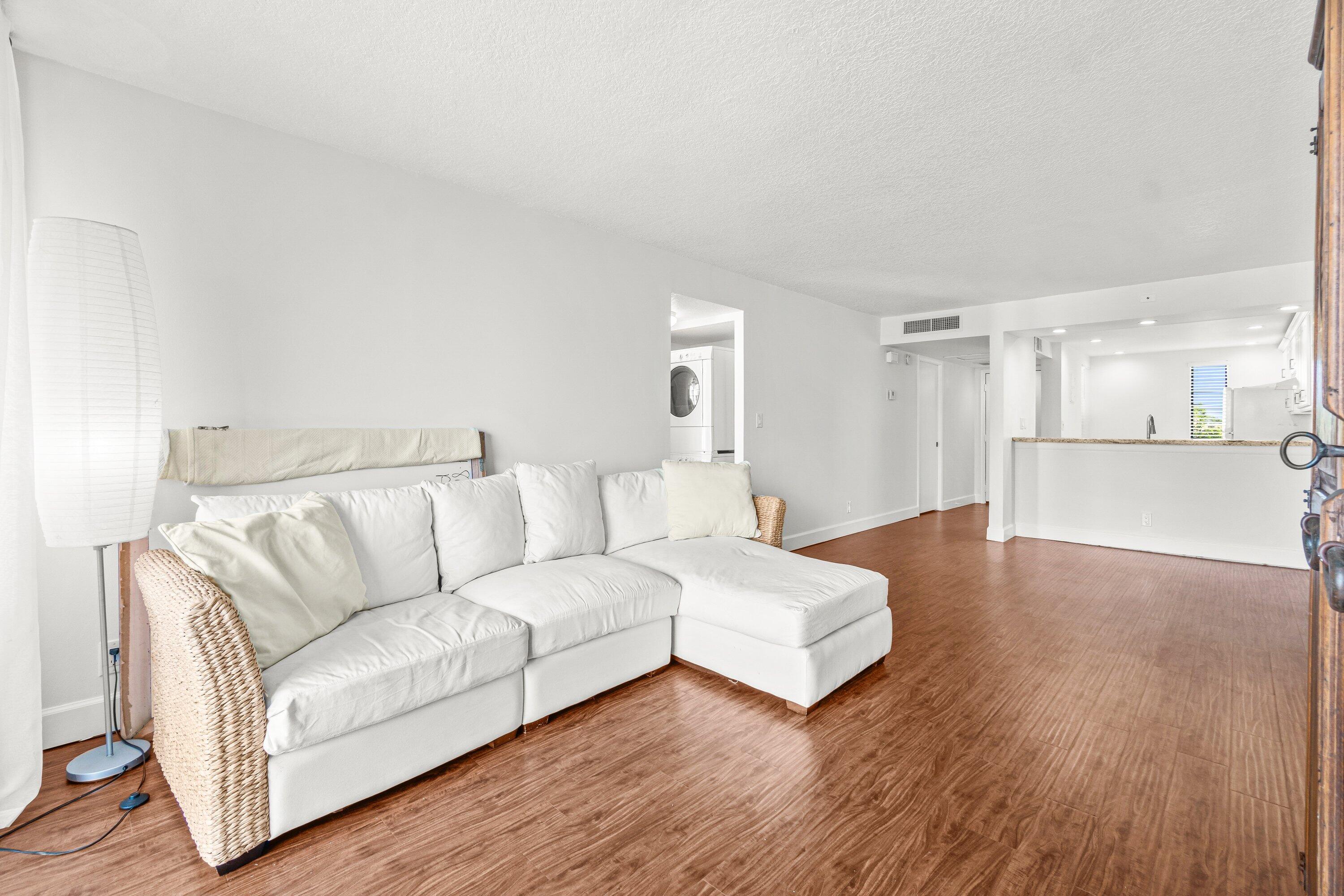 15 Royal Palm Way, Unit 604 Boca Raton, FL 33432 - Photo 13 of 41 a view of a livingroom with furniture and wooden floor