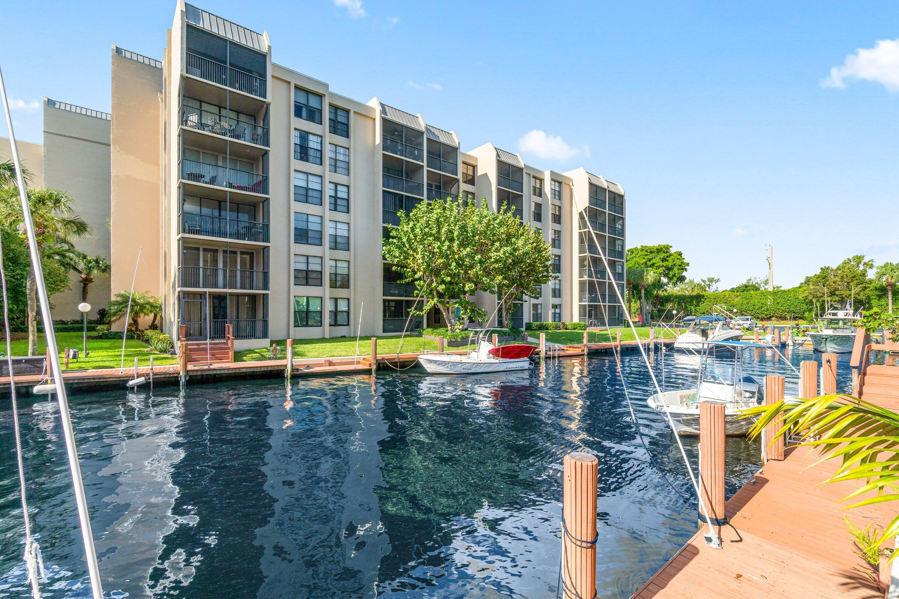 15 Royal Palm Way, Unit 604 Boca Raton, FL 33432 - Photo 29 of 41 a view of a swimming pool with a lounge chairs