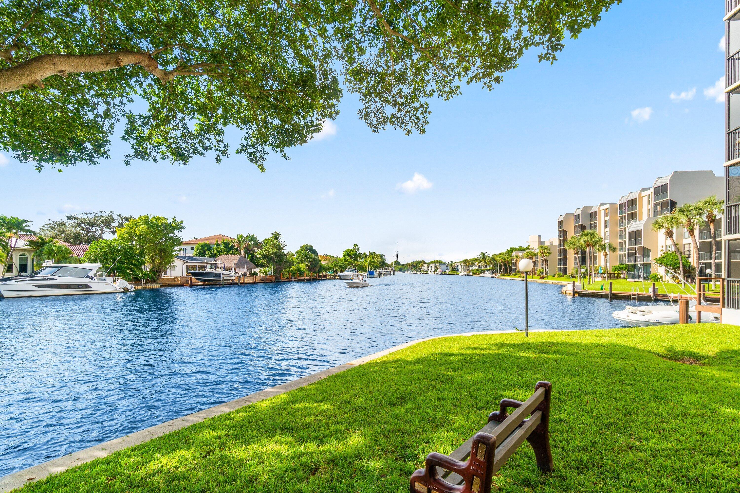 15 Royal Palm Way, Unit 604 Boca Raton, FL 33432 - Photo 35 of 41 a view of a lake with a garden