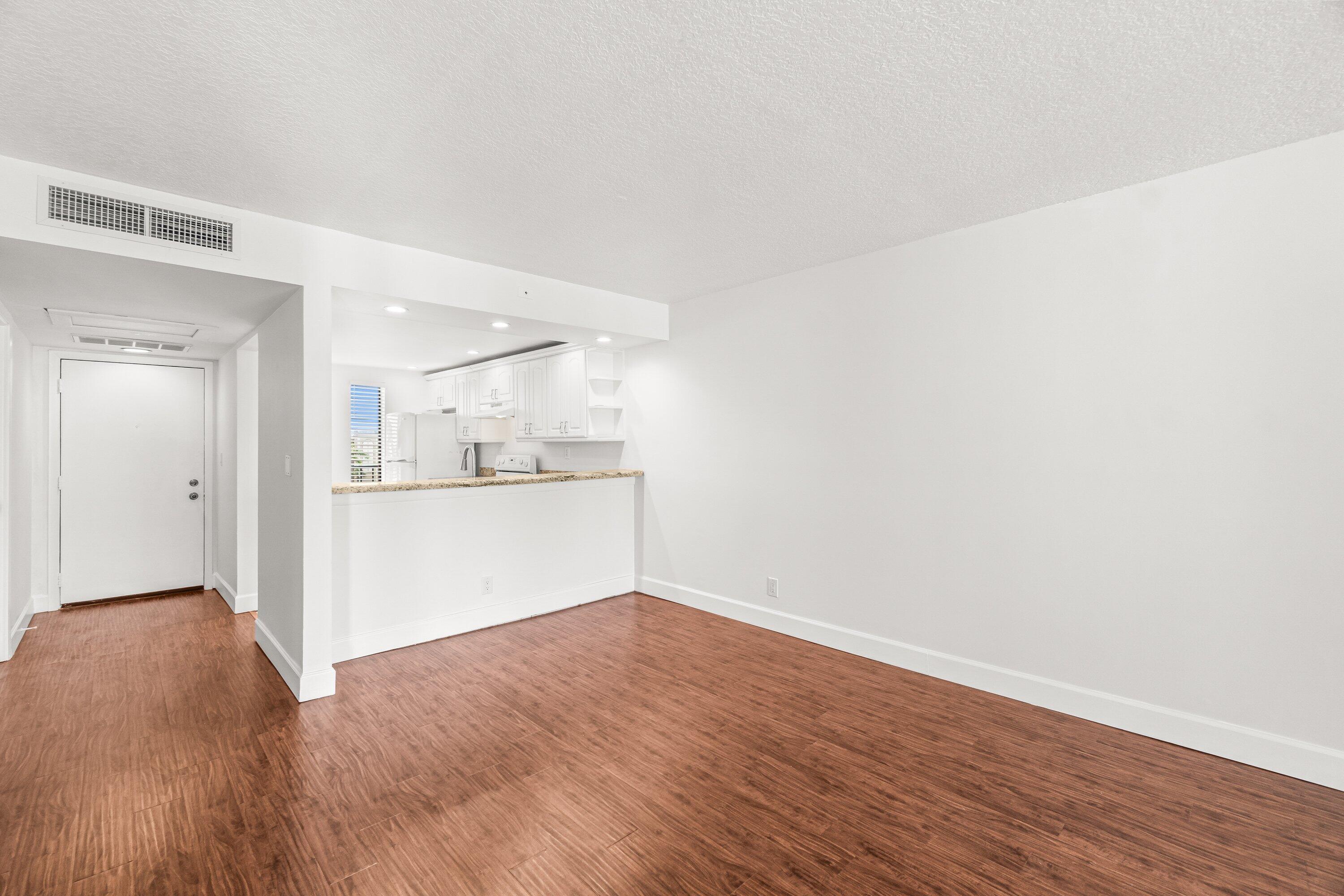 15 Royal Palm Way, Unit 604 Boca Raton, FL 33432 - Photo 4 of 41 a view of kitchen with wooden floor