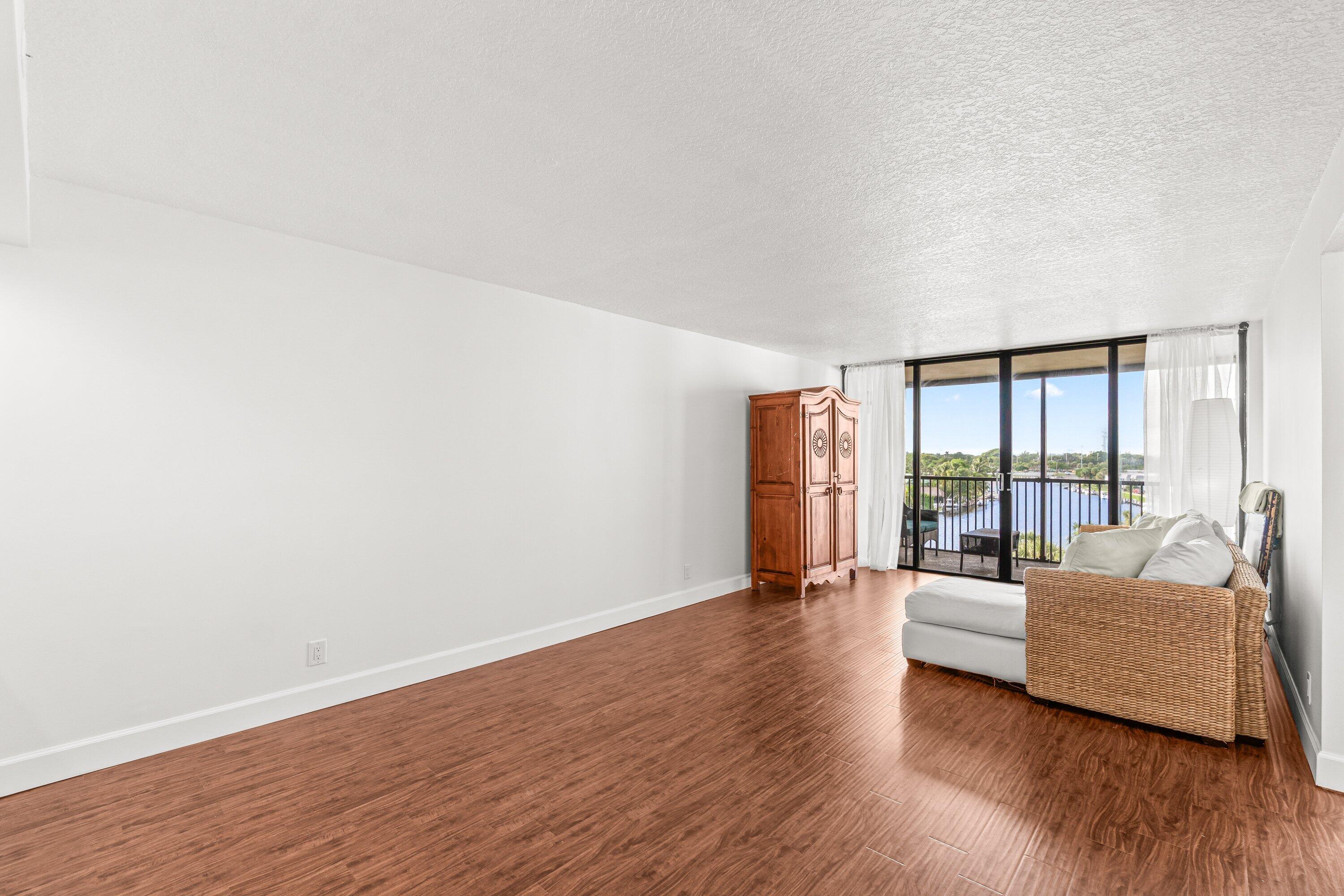 15 Royal Palm Way, Unit 604 Boca Raton, FL 33432 - Photo 9 of 41 a living room with furniture and a large window