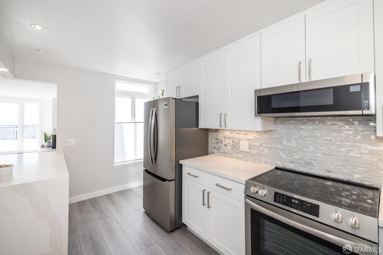 833 Corbett Avenue San Francisco, CA 94131 - Photo 16 of 22 a kitchen with a stove and a microwave