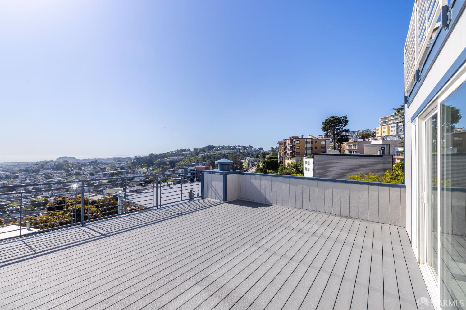 833 Corbett Avenue San Francisco, CA 94131 - Photo 6 of 22 a view of roof deck with a barbeque and wooden floor