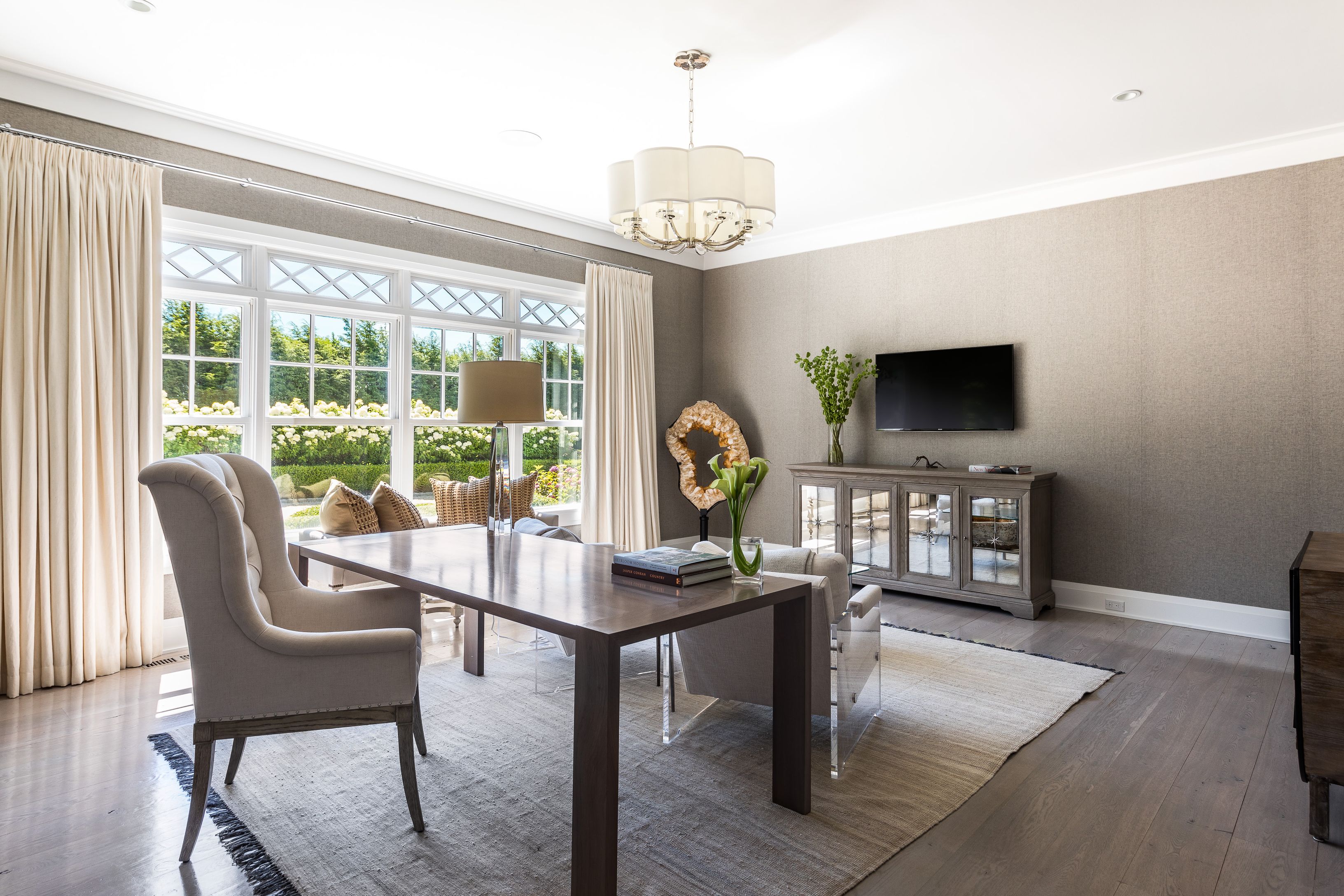 900 Head Of Pond Road Water Mill, NY 11976 - Photo 18 of 41 a work room with furniture a flat screen tv and a large window