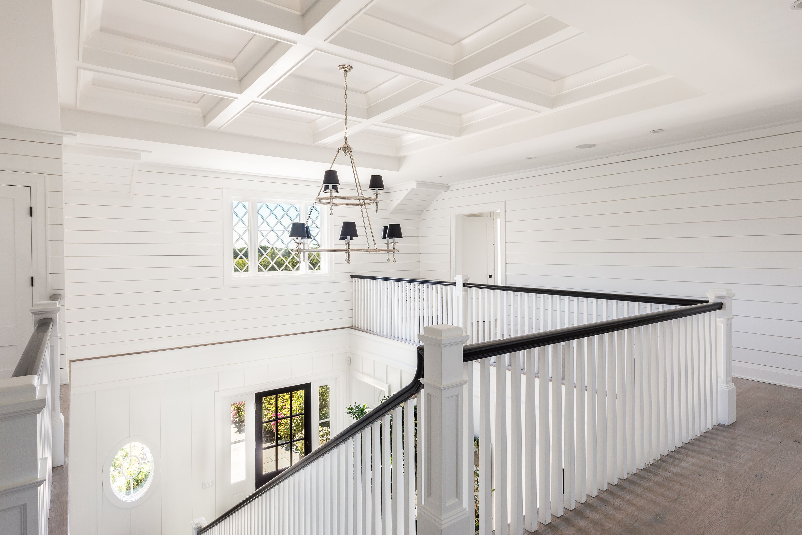900 Head Of Pond Road Water Mill, NY 11976 - Photo 20 of 41 a view of staircase and kitchen with wooden floor