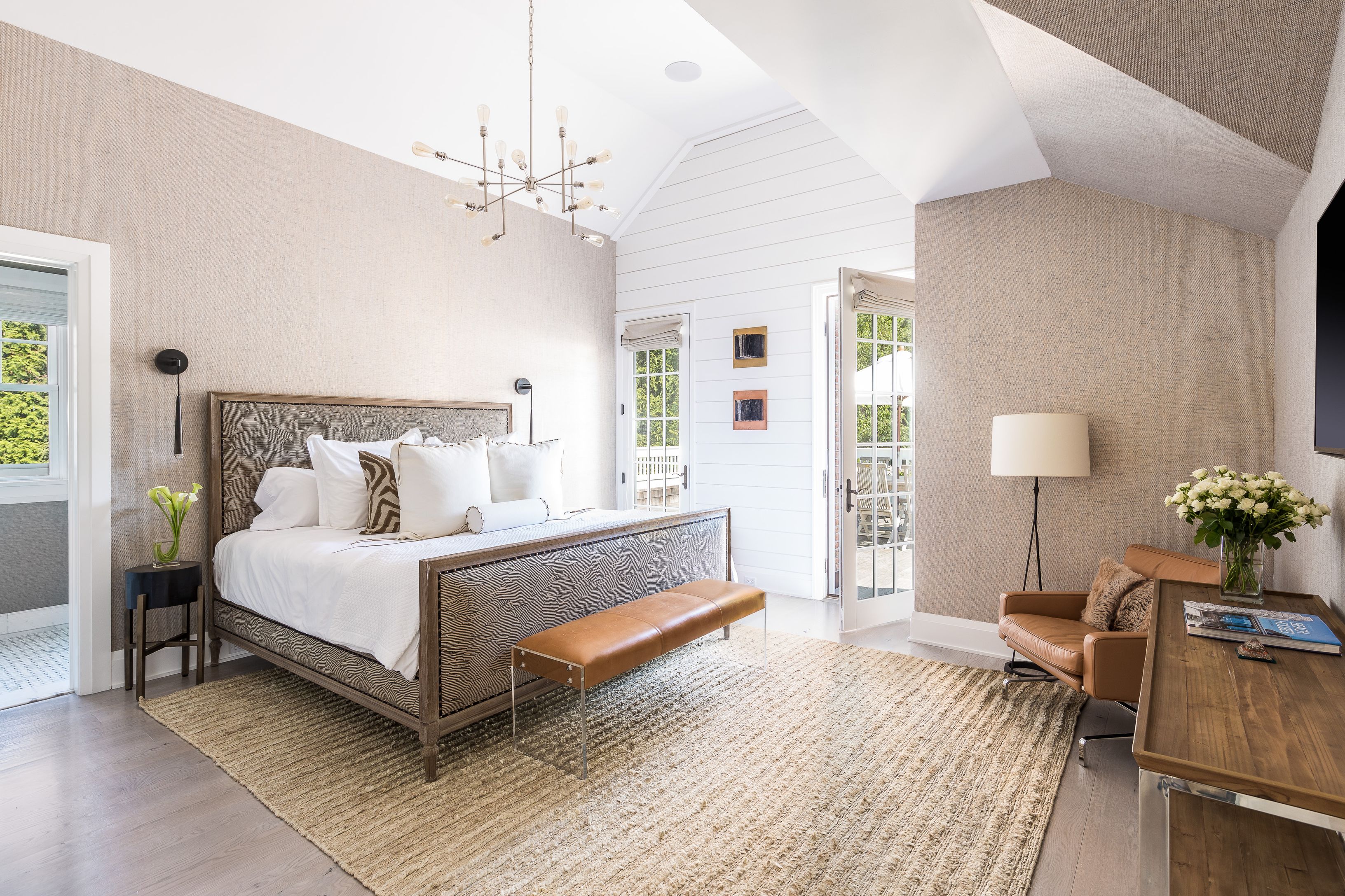 900 Head Of Pond Road Water Mill, NY 11976 - Photo 21 of 41 a bed room with a bed and a chandelier