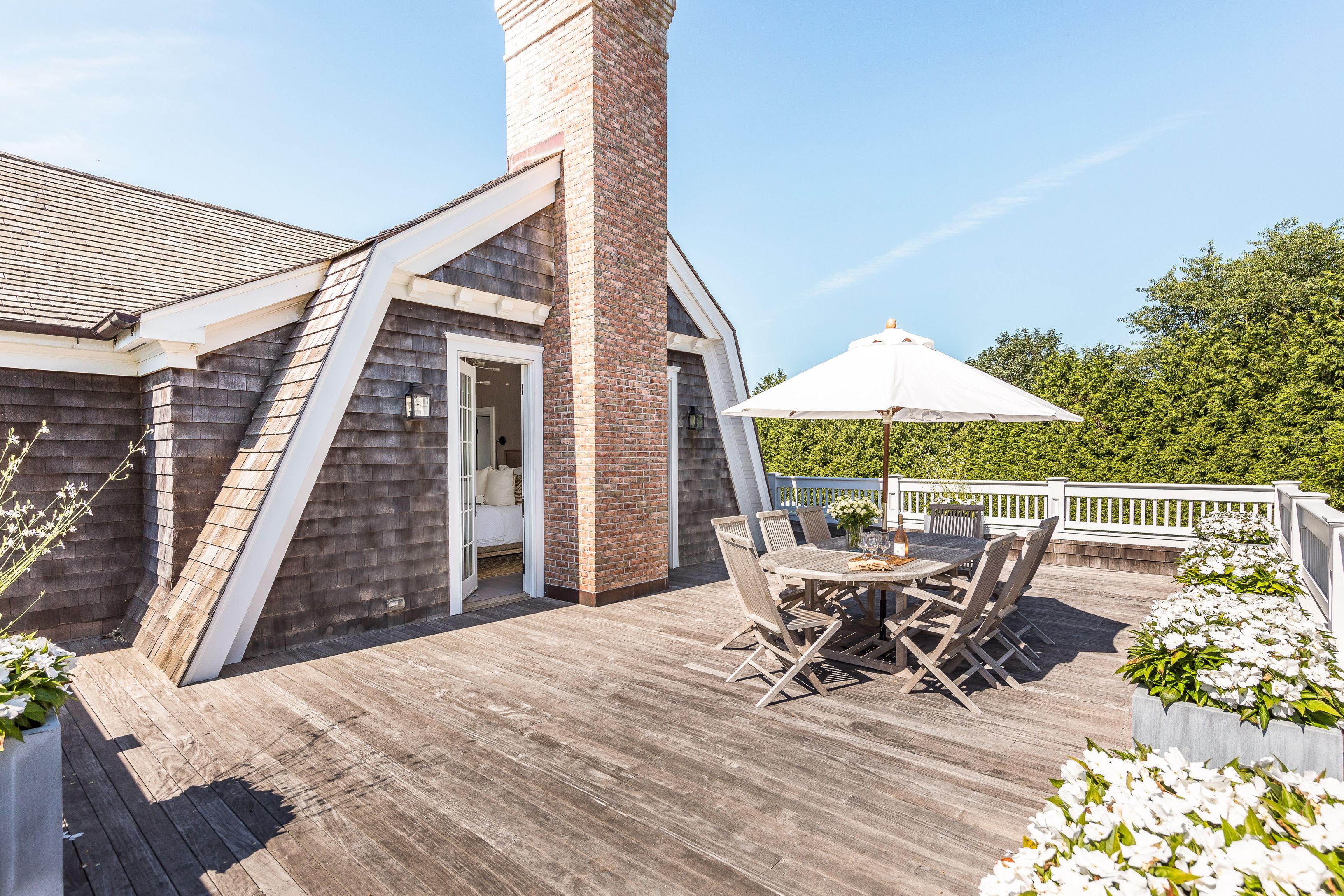 900 Head Of Pond Road Water Mill, NY 11976 - Photo 22 of 41 a patio with table and chairs
