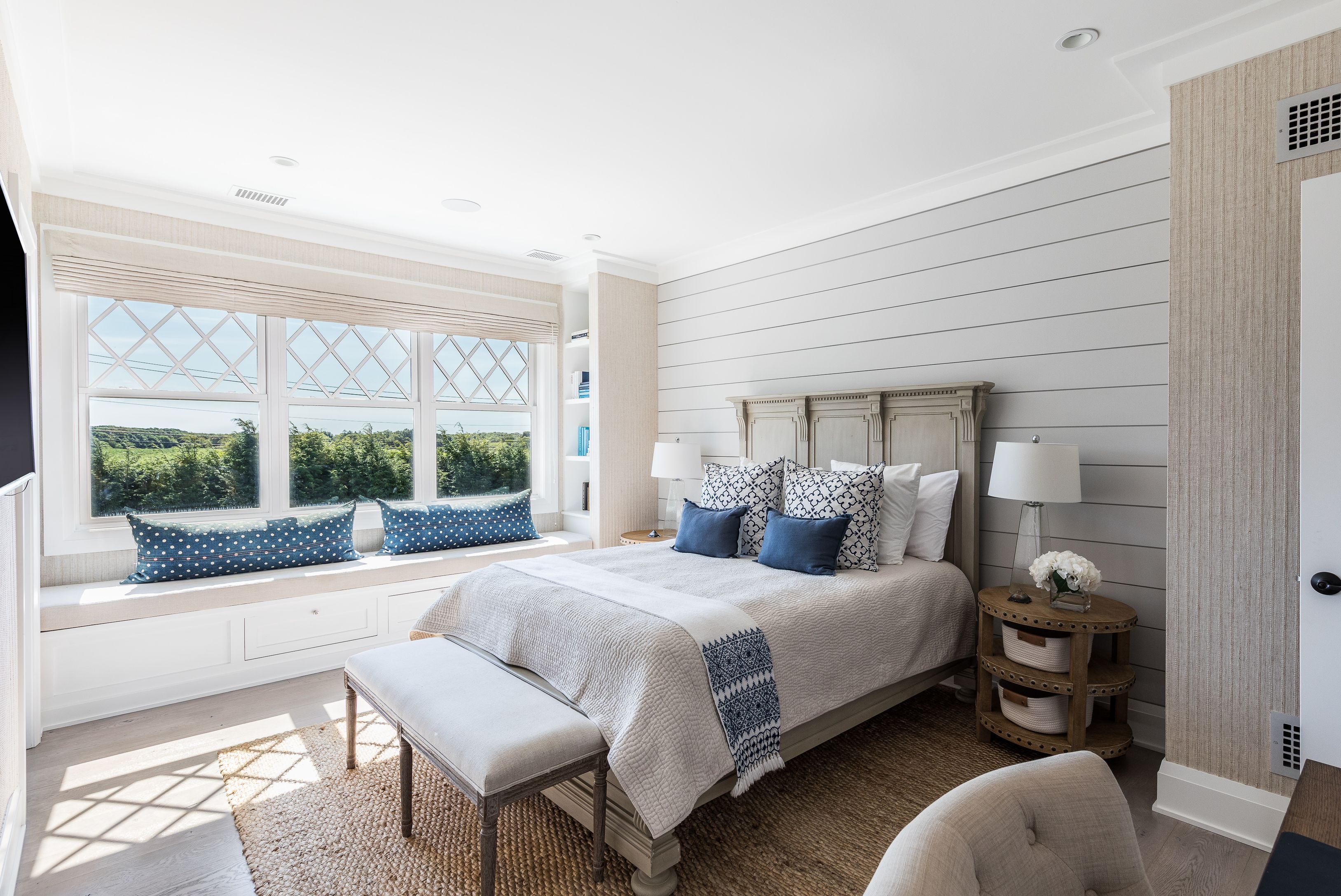 900 Head Of Pond Road Water Mill, NY 11976 - Photo 24 of 41 a bedroom with a bed and a large window