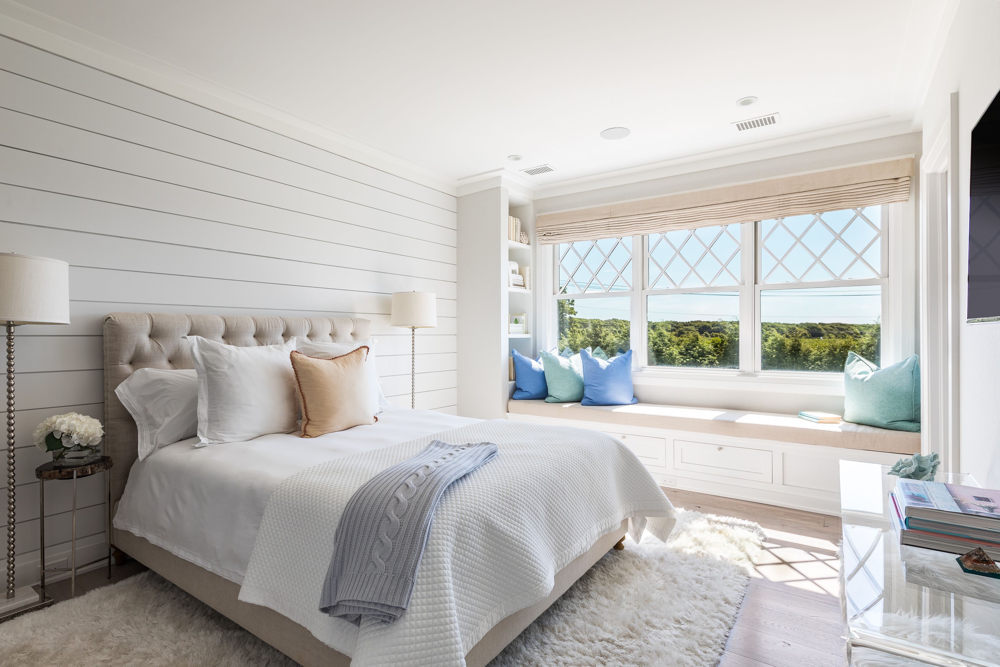 900 Head Of Pond Road Water Mill, NY 11976 - Photo 26 of 41 a large bed sitting in a bedroom next to a window