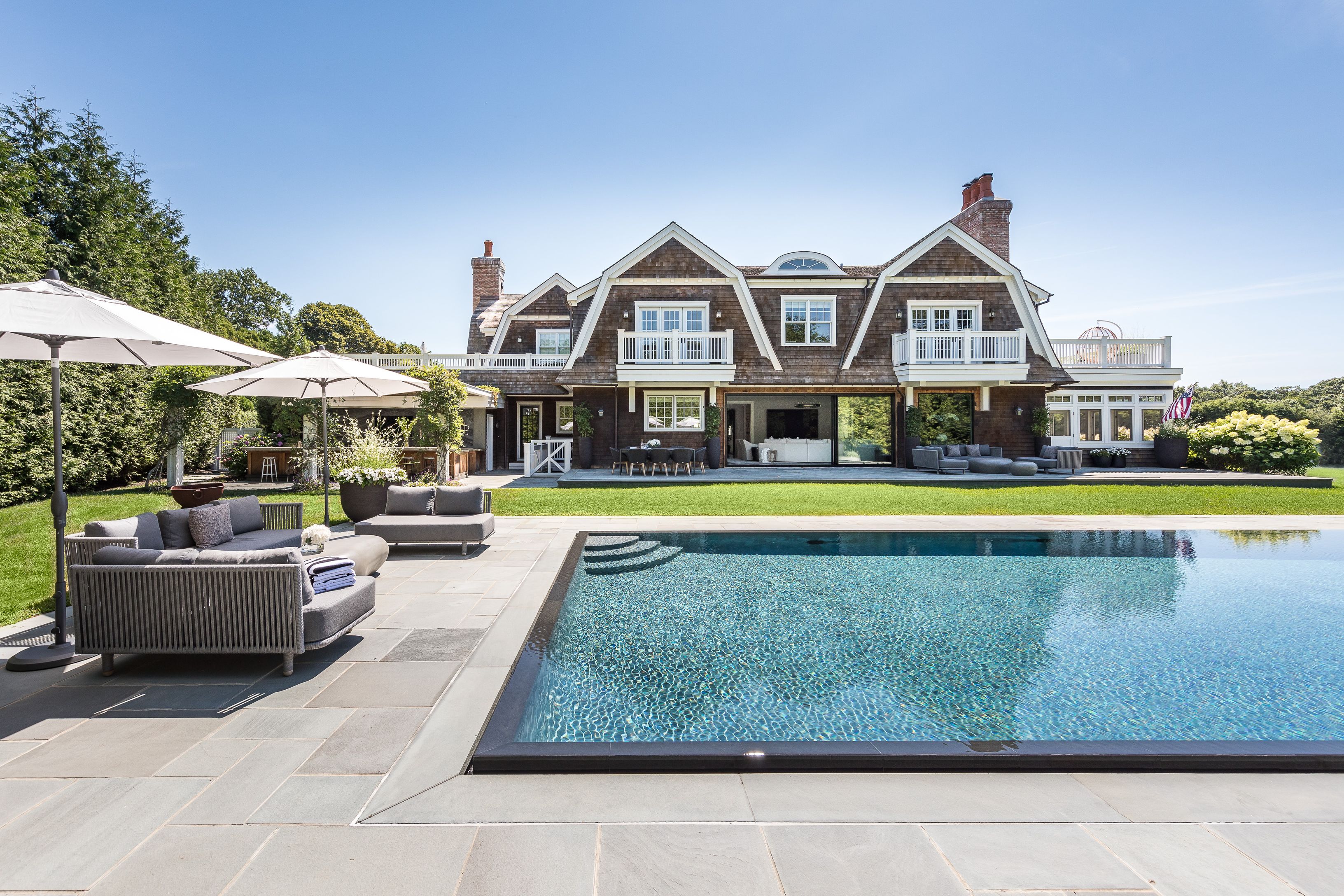 900 Head Of Pond Road Water Mill, NY 11976 - Photo 3 of 41 a view of house with swimming pool and outdoor seating