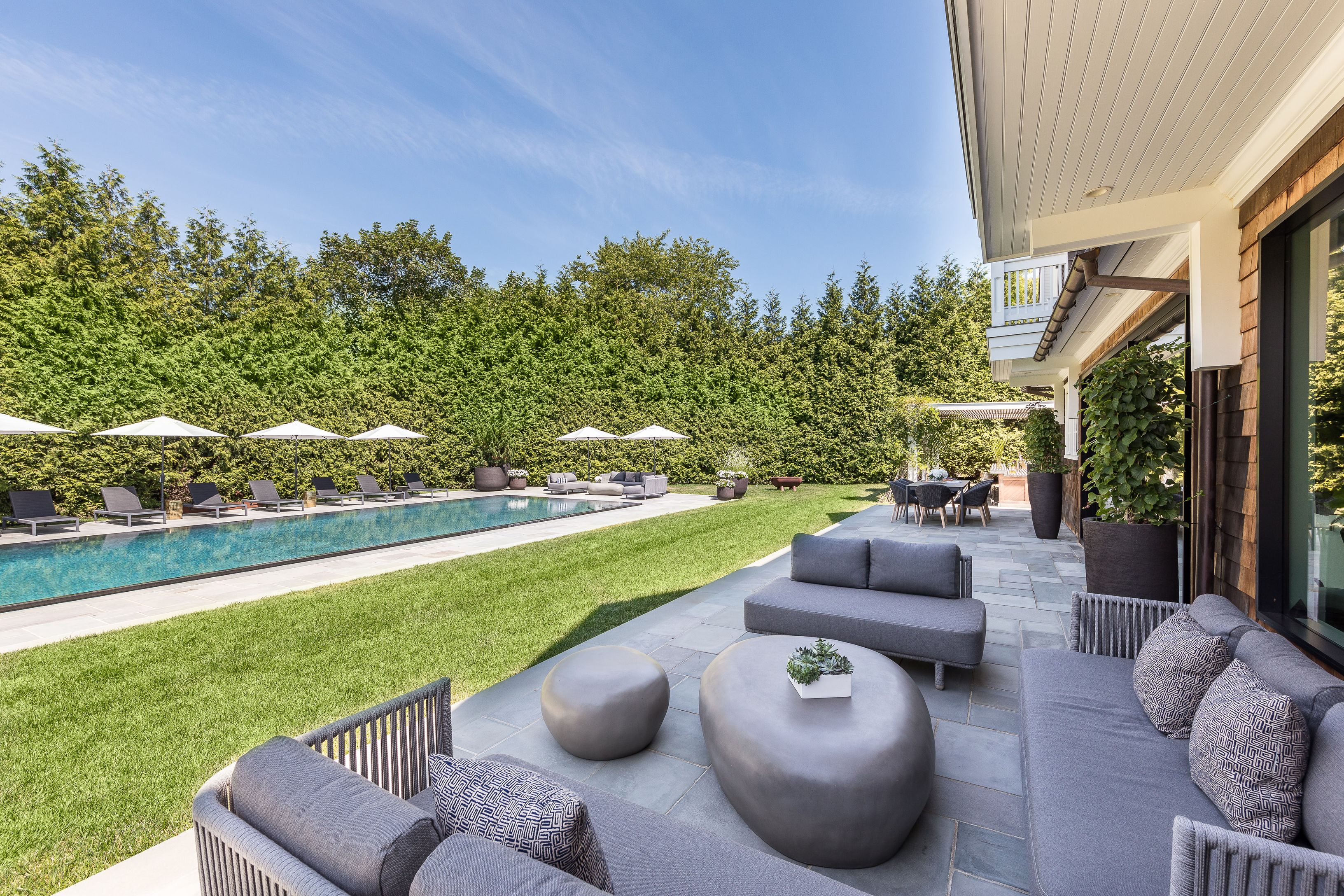 900 Head Of Pond Road Water Mill, NY 11976 - Photo 34 of 41 a view of a patio with couches chairs and a yard