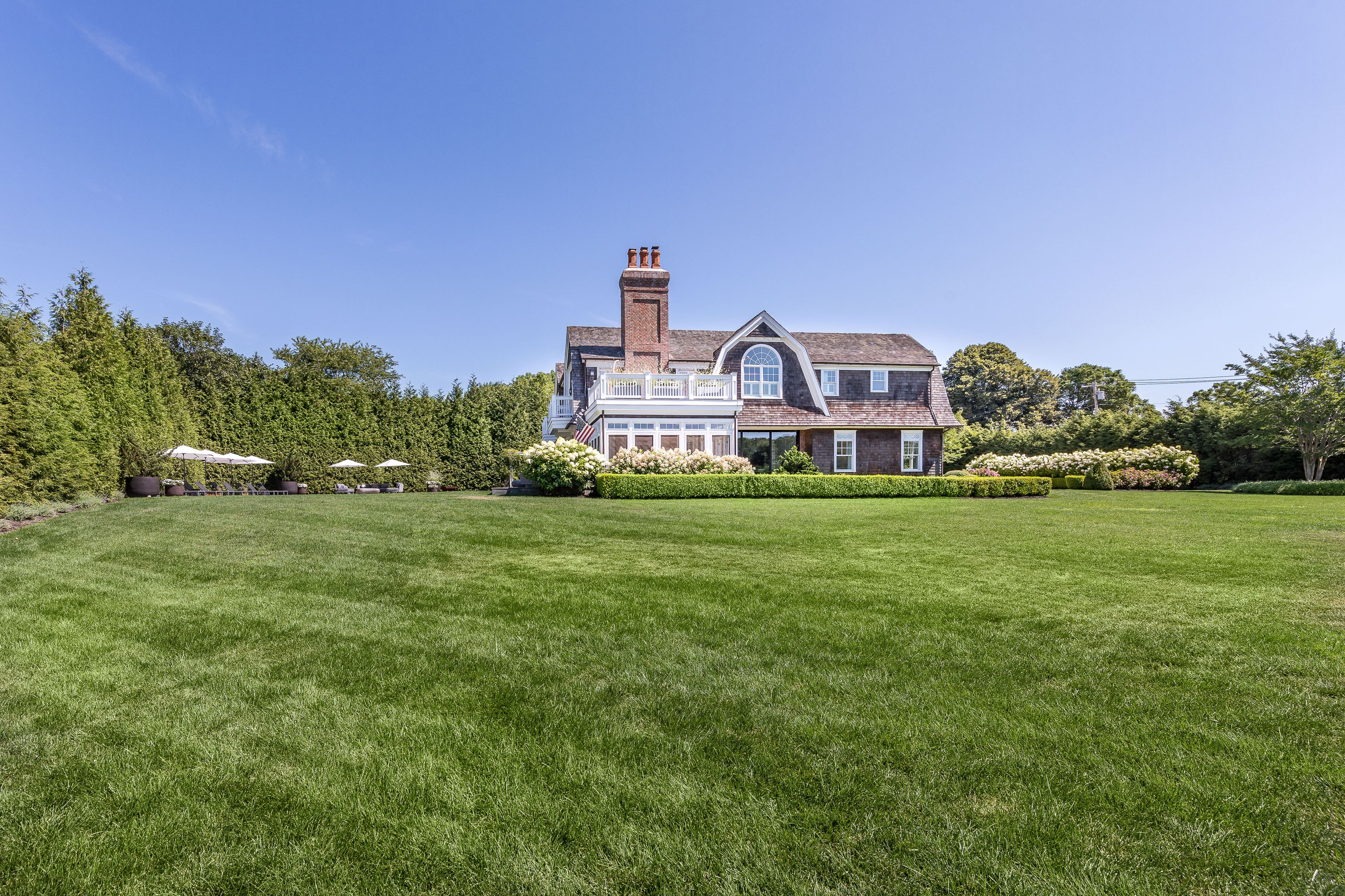 900 Head Of Pond Road Water Mill, NY 11976 - Photo 37 of 41 a front view of a house with a big yard
