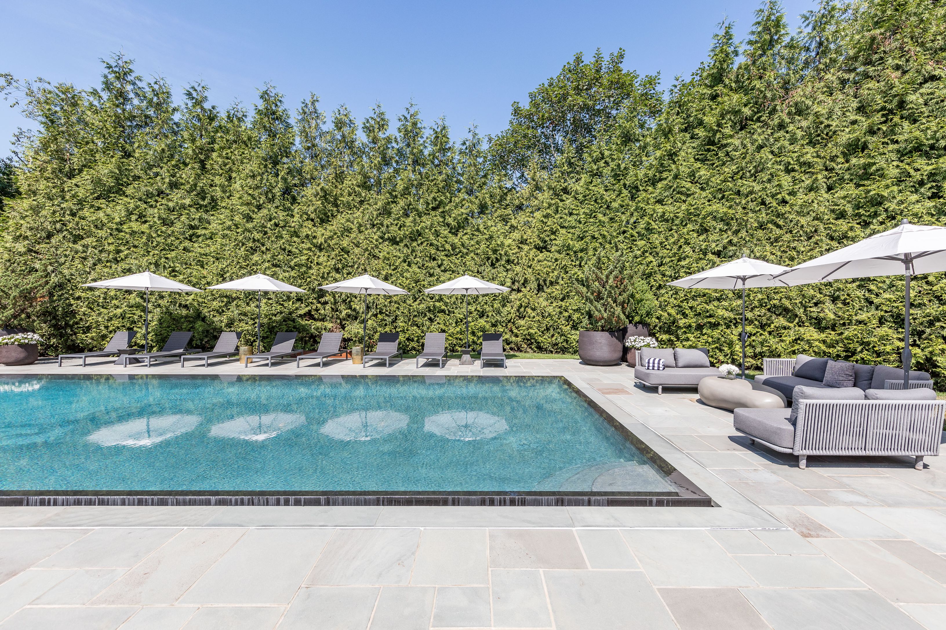 900 Head Of Pond Road Water Mill, NY 11976 - Photo 39 of 41 a view of a couches in a backyard