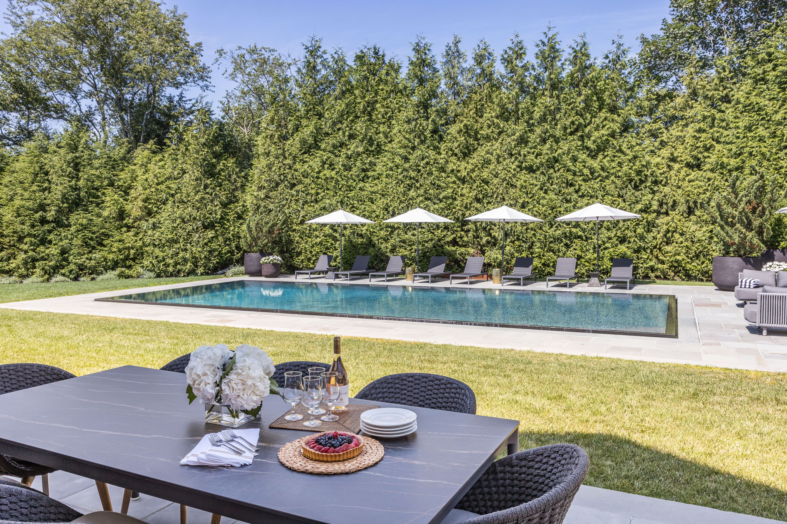 900 Head Of Pond Road Water Mill, NY 11976 - Photo 4 of 41 a view of swimming pool with seating space