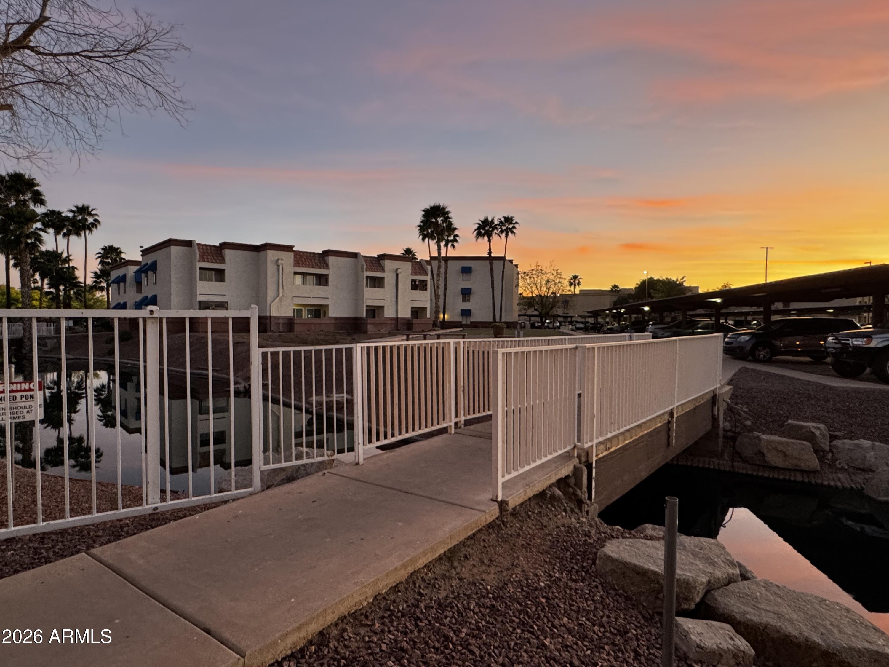 12123 West Bell Road, Unit 258 Surprise, AZ 85378 - Photo 30 of 30 a view of a balcony with an outdoor seating
